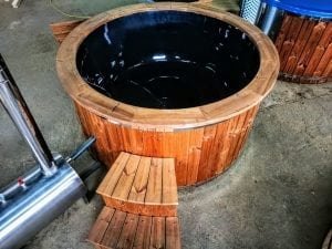 Outdoor hot tub with wood fired external burner black fiberglass thermo wood 4