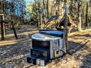 Black fiberglass lined hot tub with integrated burner Wellness Scandinavian 35