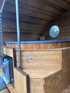 Ovale buitensauna met geintegreerd bubbelbad 10