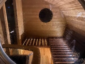 Ovale buitensauna met geintegreerd bubbelbad 32