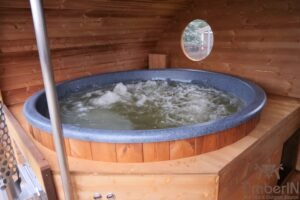 Ovale buitensauna met geintegreerd bubbelbad 47