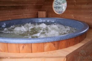 Ovale buitensauna met geintegreerd bubbelbad 50